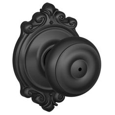 a black door knob with an ornate design