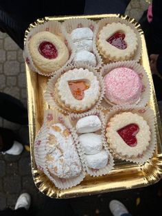 a tray filled with lots of different types of pastries