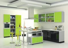 a green and white kitchen with lots of counter space