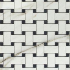 a white and black tile pattern on the floor