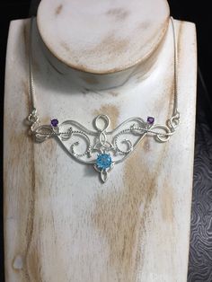 I love Victorian and Renaissance style statement necklaces with a magical and timeless flair, and I hope I've captured it within this piece! I shall fabricate for you this gorgeous Elvish/Renaissance style necklace, in sterling silver, with a center 8mm Blue Topaz and two side 4mm Amethyst gemstones. The center gemstone is 8mm round and the two sides are 4mm round. The chain will be soldered to each side and I will use a 1.2mm thick sterling box chain with a lobster claw clasp for added straight Victorian Boho, Statement Necklaces, Sapphire Necklace, Moon Pendant, Style Necklace, Necklace Sterling Silver, Style Statement, Faceted Gemstones, Amethyst Gemstone