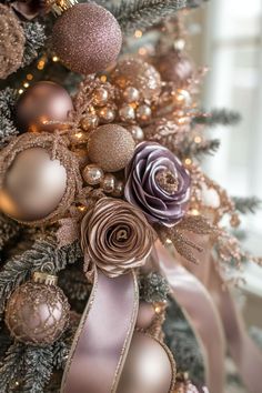 a christmas tree decorated with ornaments and ribbons