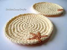 two crocheted coasters with starfish on them