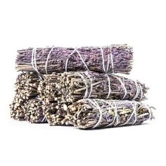 several bundles of lavender sticks stacked on top of each other