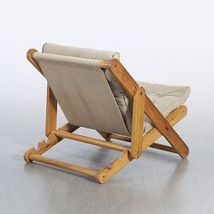 a chair that is made out of wood and fabric