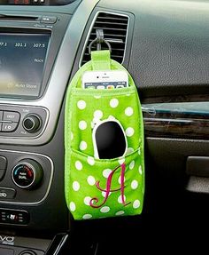 a cell phone holder in the center of a car