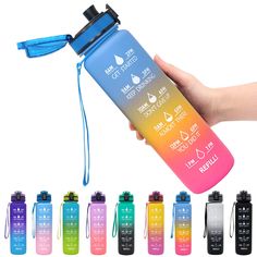 a hand holding a water bottle with different colors