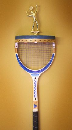 a tennis racket hanging on the wall