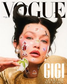 a magazine cover with a woman's face covered in stickers on her cheek