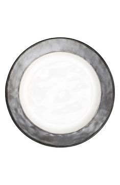 an empty plate on a white background with no one in the photo to describe it