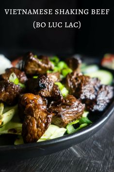 beef and lettuce salad in a bowl with the words vietnamese shaving beef