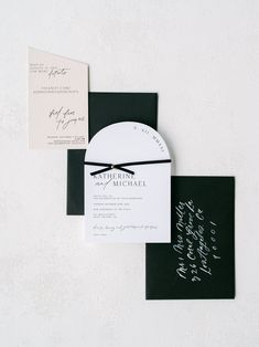 an elegant black and white wedding suite with calligraphy on the front, back and inside