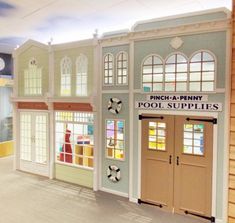 the inside of a toy store with doors and windows