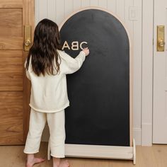 Part chalkboard, part whiteboard, and all magnetic, this charming arched canvas is the perfect creative companion. Details · Great for all ages. · Magnetic. · Sturdy wooden structure. · Easily wipeable, extra durable, and packed with fun. Dimensions One size Measures 46in X 26in x 1.5in Weighs 6 lbs Shipping Information Orders will process within 7 business days unless listed as Pre-Order. Letter Magnets, Diy Whiteboard, Childrens Purses, Chalkboard Baby, Baby Activity Gym, Magnetic Chalkboard, Kids Blocks, Wooden Structure, Wall Seating