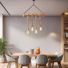 a dining room table and chairs with lights hanging from the ceiling