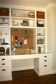 a white desk topped with lots of drawers