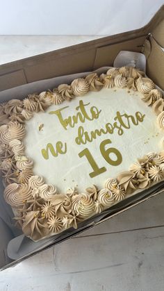 a cake in a box with the number sixteen on it