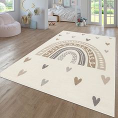 a white rug with hearts and a rainbow on it in a child's room