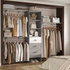 an open closet with clothes and shoes hanging on the shelves, along with a bed