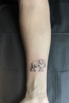 a small elephant tattoo on the ankle