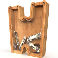 a wooden holder with money and keys in it