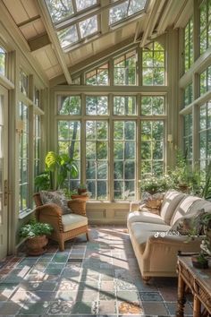 a sun room with lots of windows and furniture