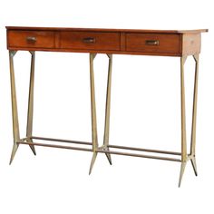 a wooden table with two drawers on one side and an iron frame at the bottom