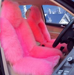 the interior of a car with pink fur