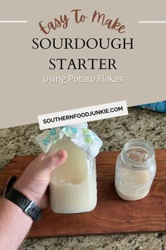 someone is holding up a jar with some food in it and the words easy to make sourdough starter using potato flakes