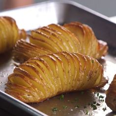 potatoes on a baking sheet ready to be cooked