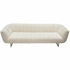 a white couch sitting on top of a wooden frame