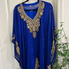 These Kaftans Are Stunning And High Quality! It Is A 2 Piece And Has Ties On Both To Make It More Snatched! It’s Embellished With Crystal And Gold Beading! Blue Party Kaftan For Eid, Festive Blue Party Kaftan, Blue V-neck Kaftan For Party, Festive Blue Embellished Kaftan, Festive Embellished Blue Kaftan, Fitted Blue Festive Kaftan, Festive Blue V-neck Kaftan, Embellished Blue Dress For Vacation, Blue Embellished Kaftan For Party