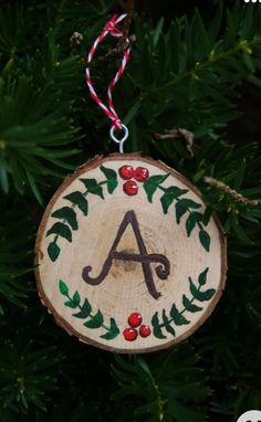 a wooden ornament hanging from a tree