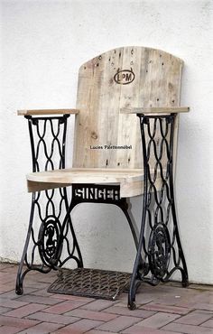 an old sewing machine turned into a table and chair for someone to sit on it