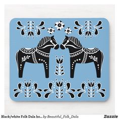 two black and white horses on blue background mousepads, one with floral designs