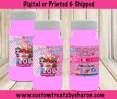 two pink bottles with the words digital or printed & shipped