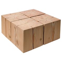 several pieces of wood stacked on top of each other in the shape of cubes