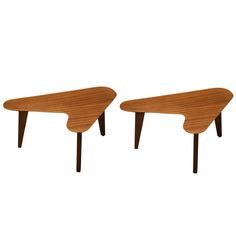 two wooden tables sitting next to each other