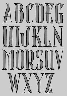 the upper and lower case of an old english alphabet, with black ink on gray paper