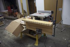 a workbench with tools and materials on it in a room that is being worked on