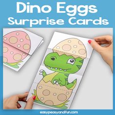 the dinosaur egg surprise cards are being held up