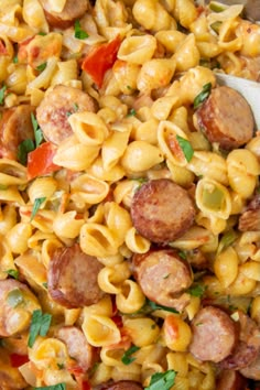 a bowl filled with pasta and sausage