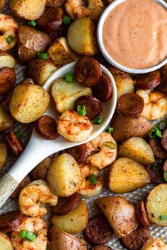 shrimp and potatoes with dipping sauce on the side