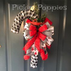 a christmas wreath hanging on the front door