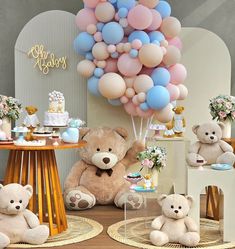 there are many balloons and teddy bears on the table