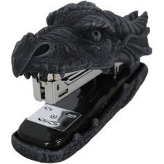 a cell phone holder made to look like a dragon's head with its mouth open