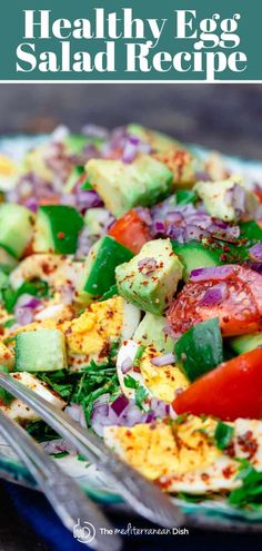 healthy egg salad recipe with avocado, tomatoes and cucumber on a plate