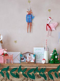 a mantle with christmas decorations on top of it