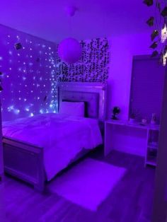 a bedroom with purple lights on the walls