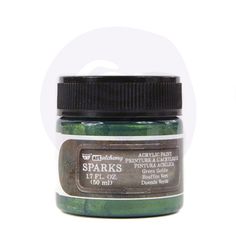 a jar of green metallic paint on a white background